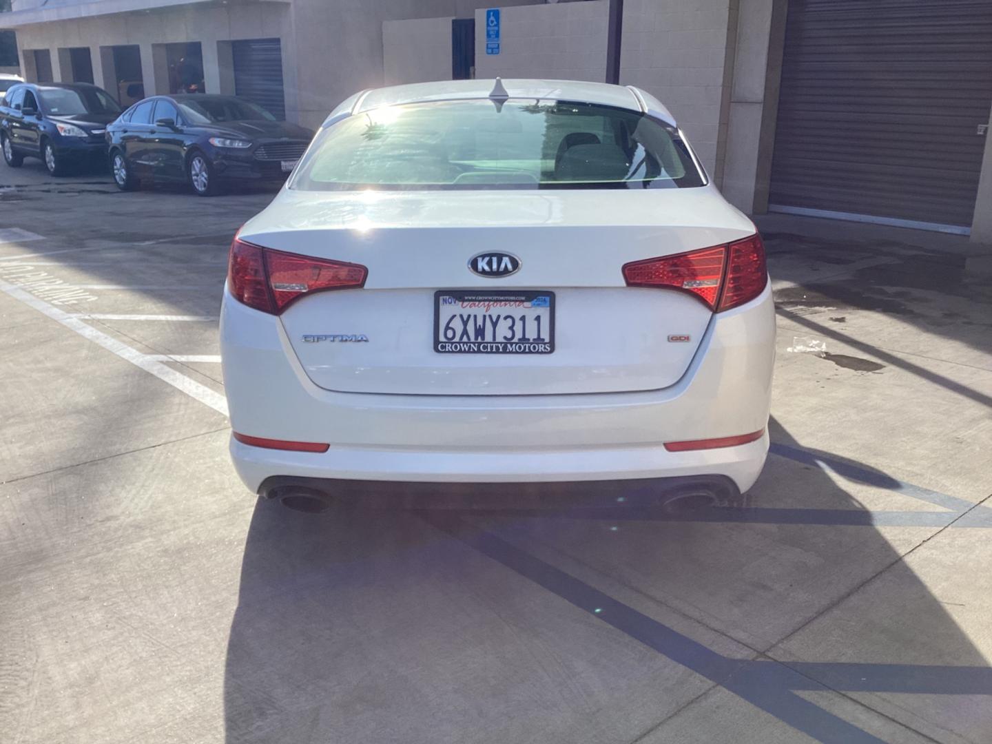 2013 WHITE Kia Optima (5XXGM4A72DG) , AUTOMATIC transmission, located at 30 S. Berkeley Avenue, Pasadena, CA, 91107, (626) 248-7567, 34.145447, -118.109398 - Crown City Motors is a used “Buy Here Pay Here” car dealer in Pasadena CA. “Buy Here Pay Here” financing, means that when you purchase your vehicle from our dealership, that you make the payments to the dealership as well. We do not need the banks approval to get you approved for a used auto - Photo#3